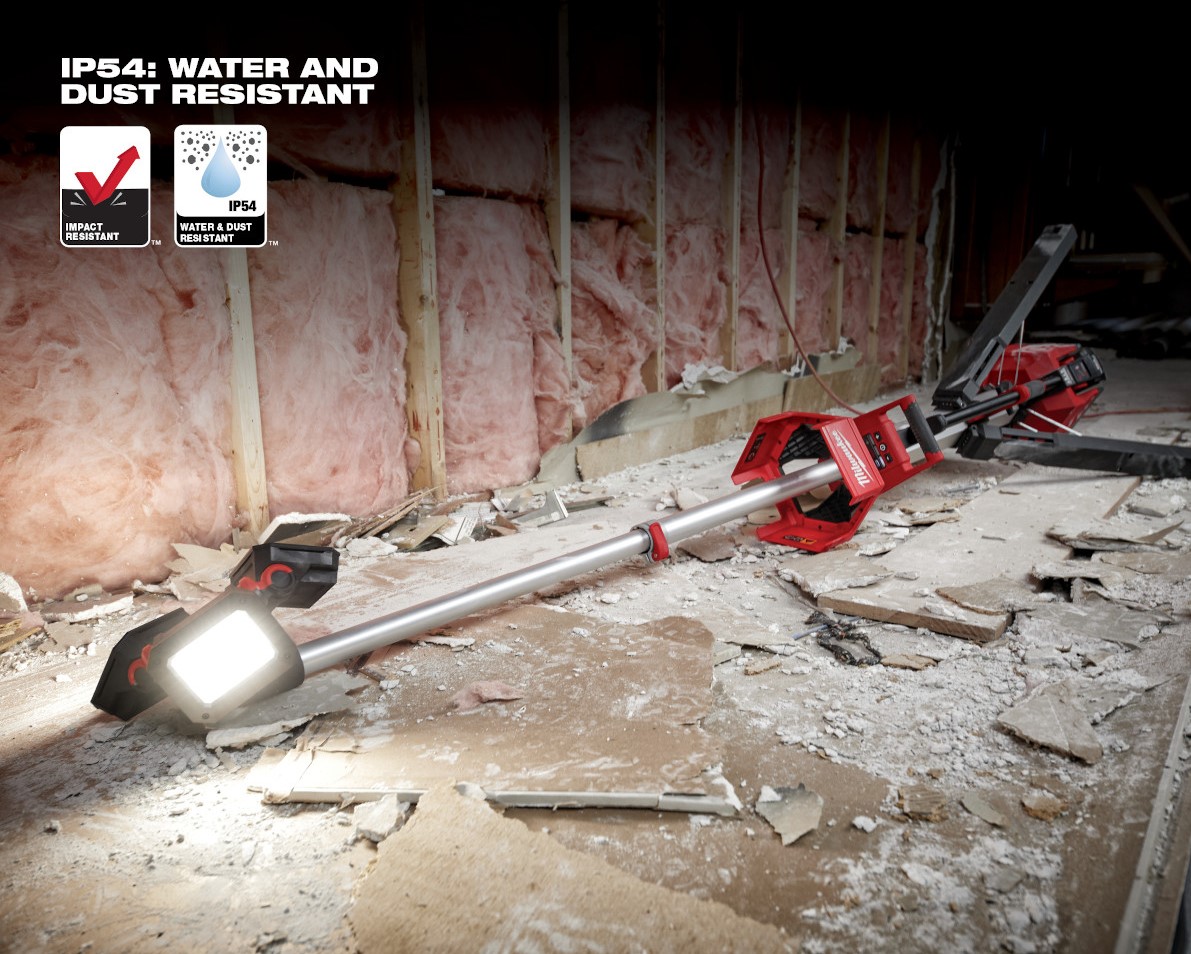 Milwaukee M18 Rocket Tower Light laying on ground lighting job site. Application for this image is insulation, demonstrating resistance to dust, water and impact from falls.