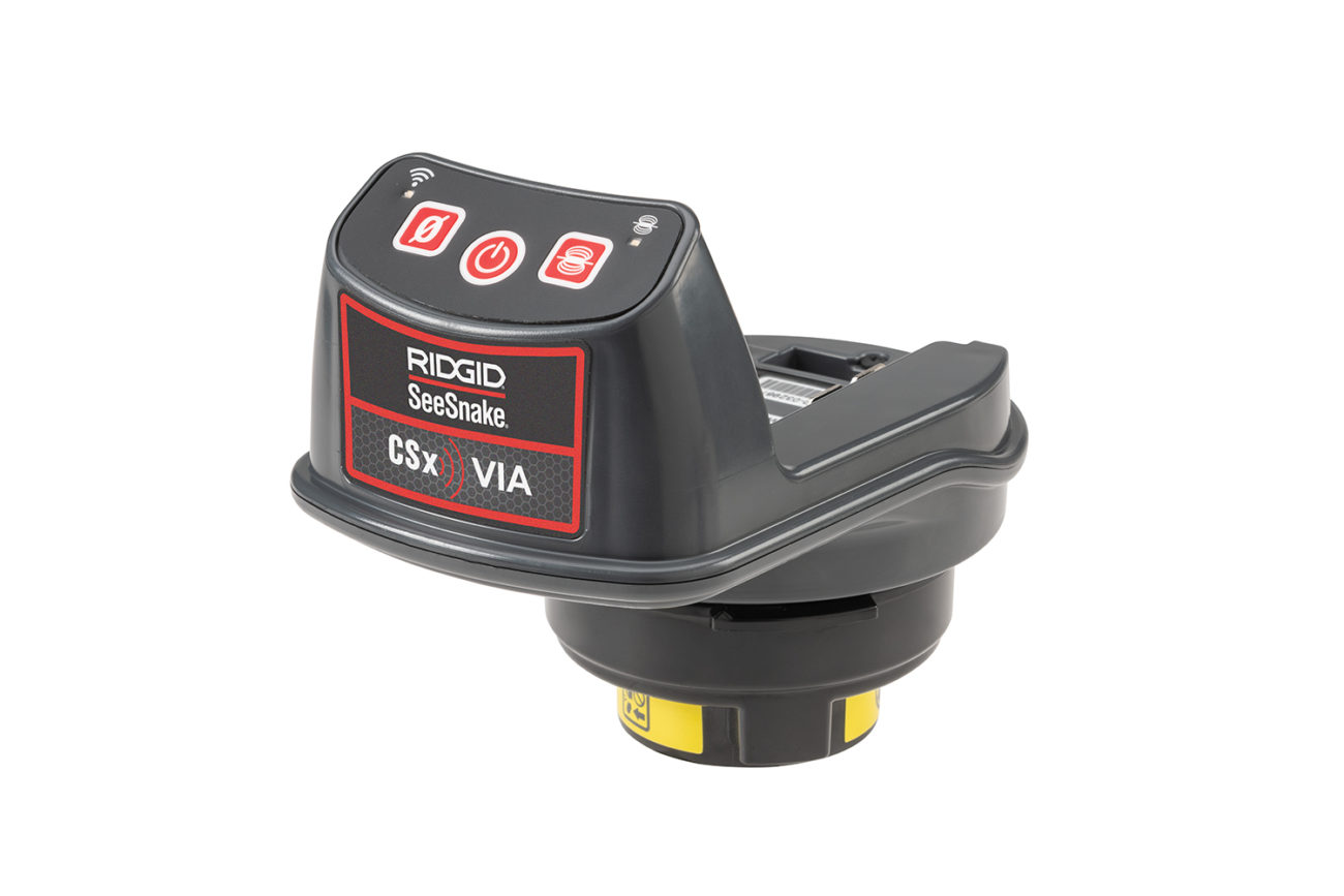 The Ridgid CSx Via SeeSnake device. Shows the small size and how it can connect to the reel, WiFi enabled light and 3 buttons for power, the counter and sonde.