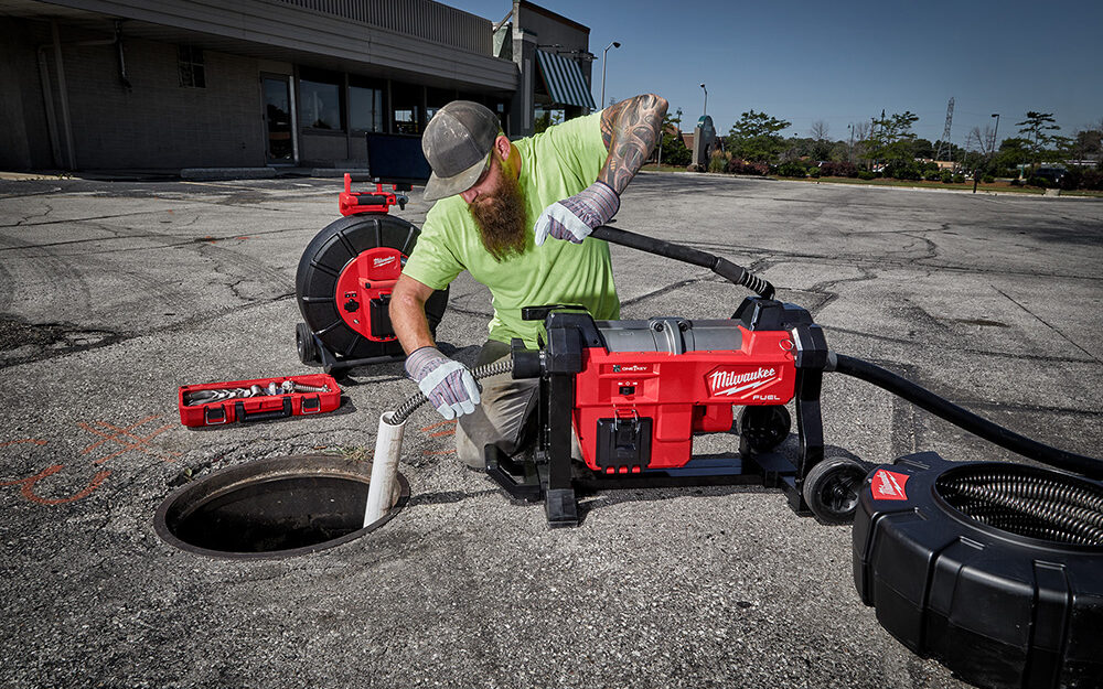 The Milwaukee M18 200’ Pipeline Inspection System Kit 2974-22 is being used on a jobsite.