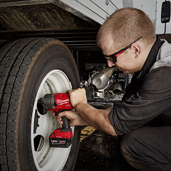 Using a Milwaukee M18 1/2" Extended Anvil Controlled Torque Impact with ONE-KEY (2769-20) to fasten bolts on a truck tire