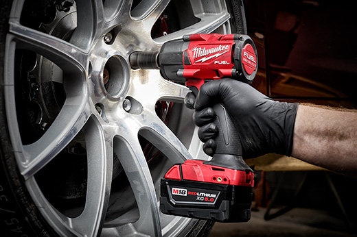 Using a Milwaukee M18 1/2" Compact Impact Wrench with Friction Ring (2855-20) to fasten bolts on a truck tire